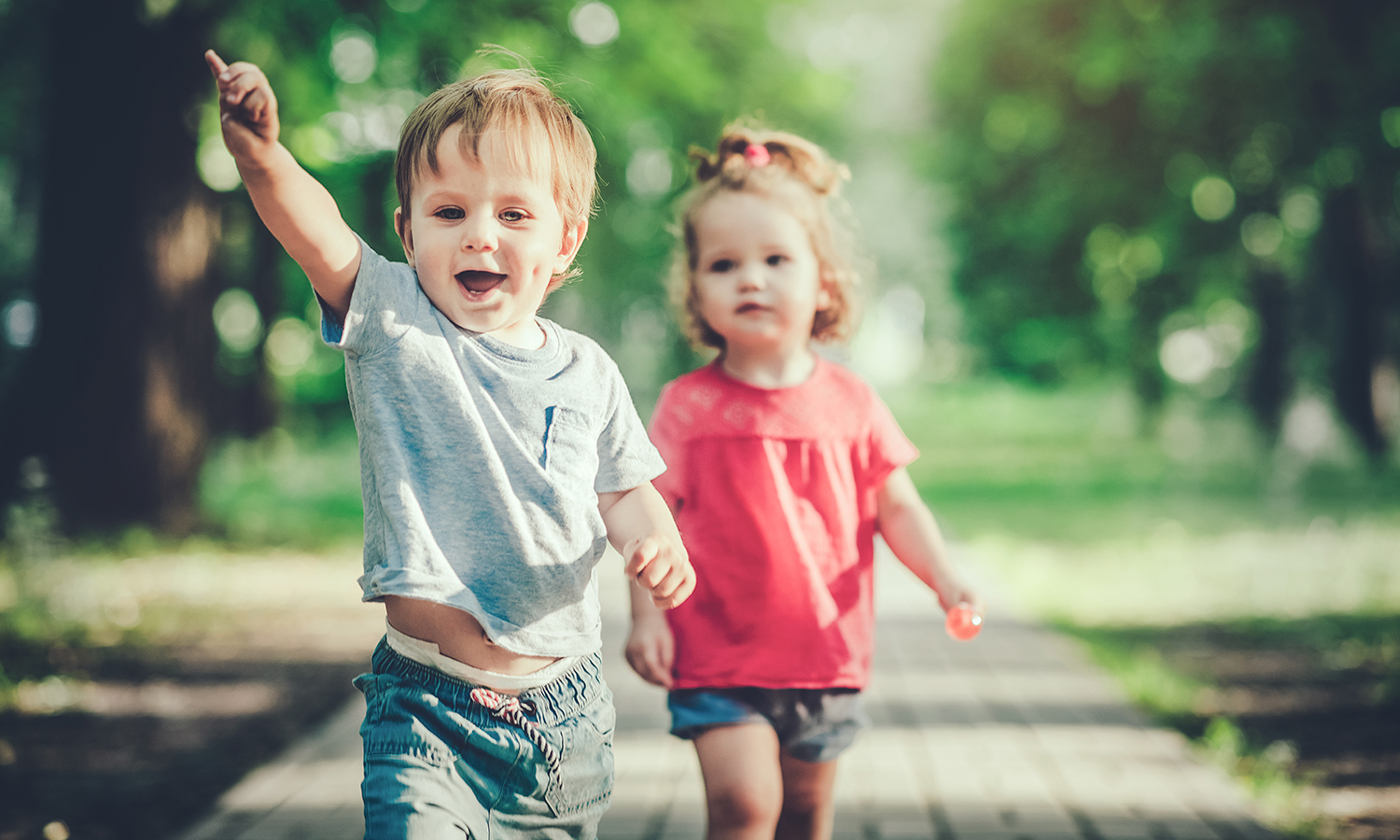 Happy children having fun in summer park
