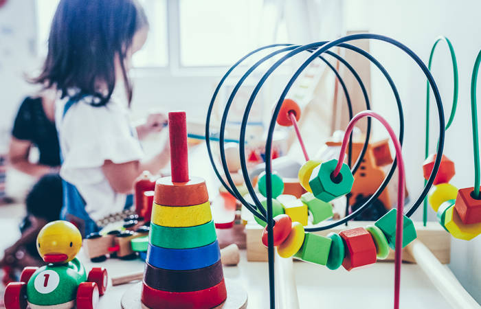 Young girl playing with toys