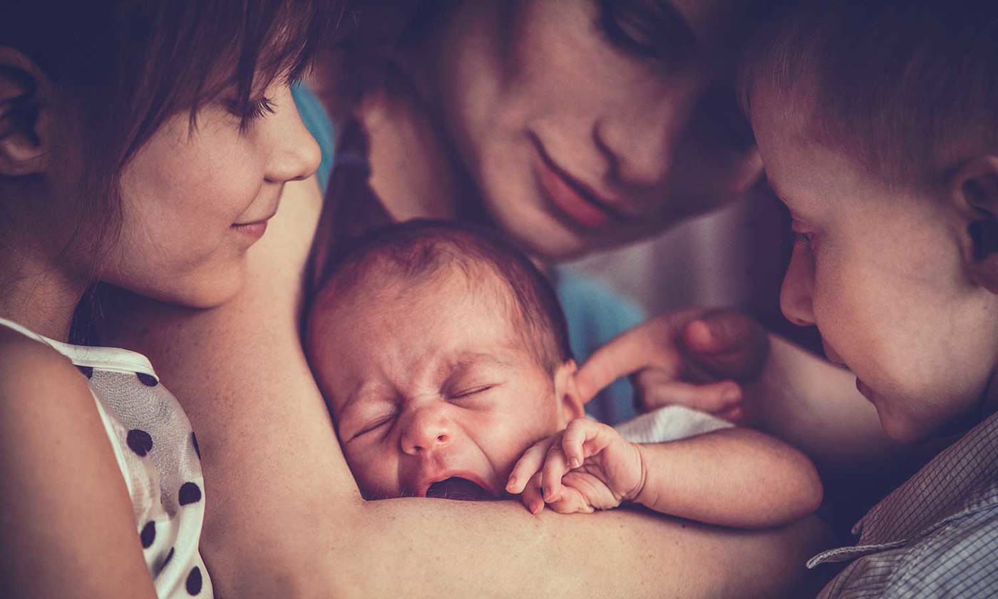 Mother with new baby and two children