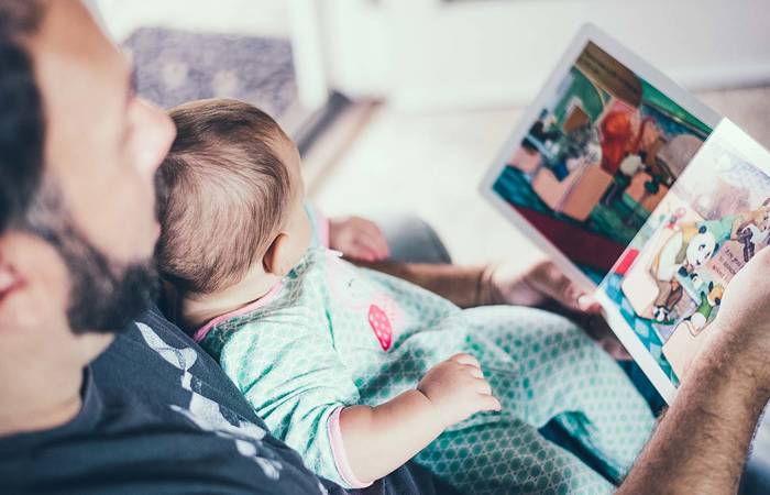 Father reading to baby