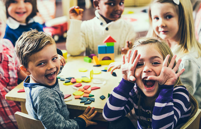 Playful preschoolers having fun making faces