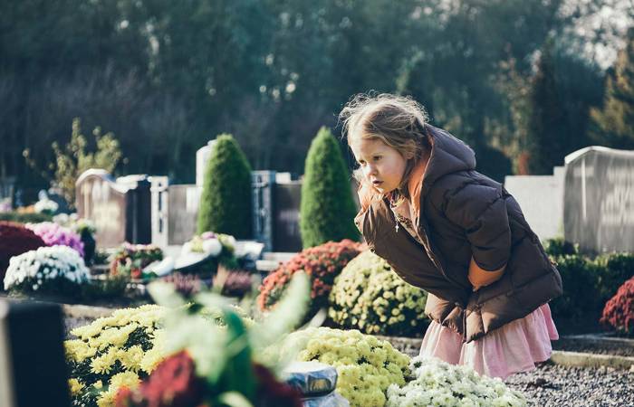 Child at a cemetery